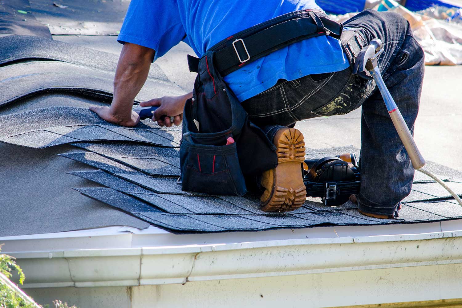 roofer working on a home rooftop